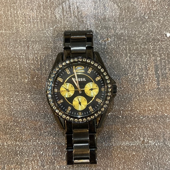 Black Fossil watch with gold and rhinestone detail. - Picture 1 of 3